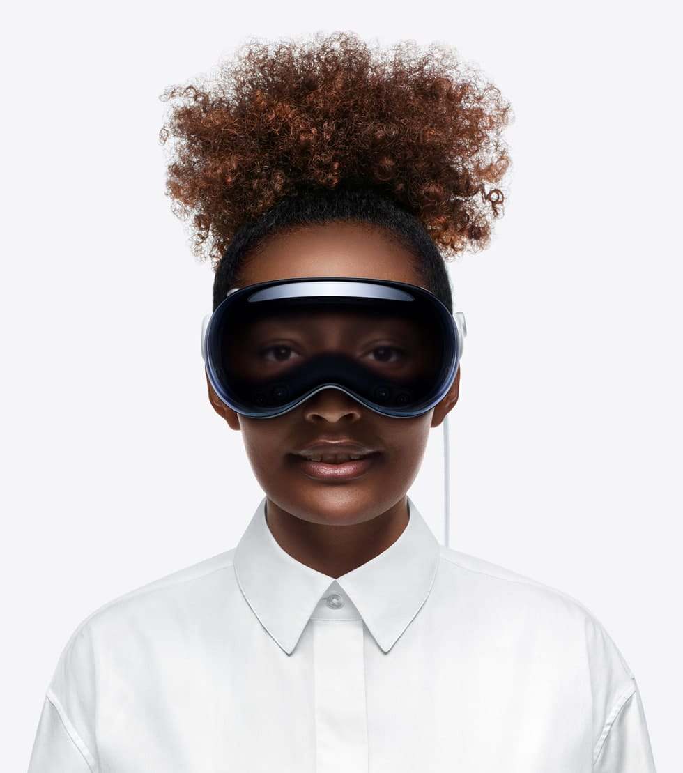 A woman wearing an Apple Vision Pro headset.